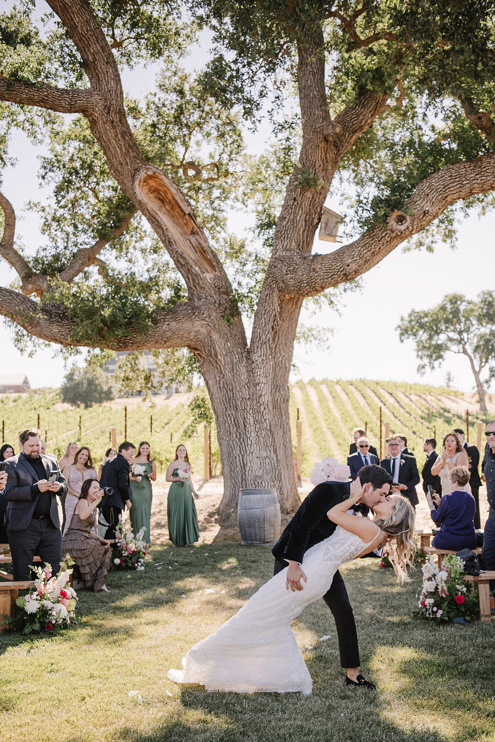 Experience the magic of a luxury wedding Ella's Vineyard in Paso Robles, CA. From breathtaking sunset photos to exquisite details.