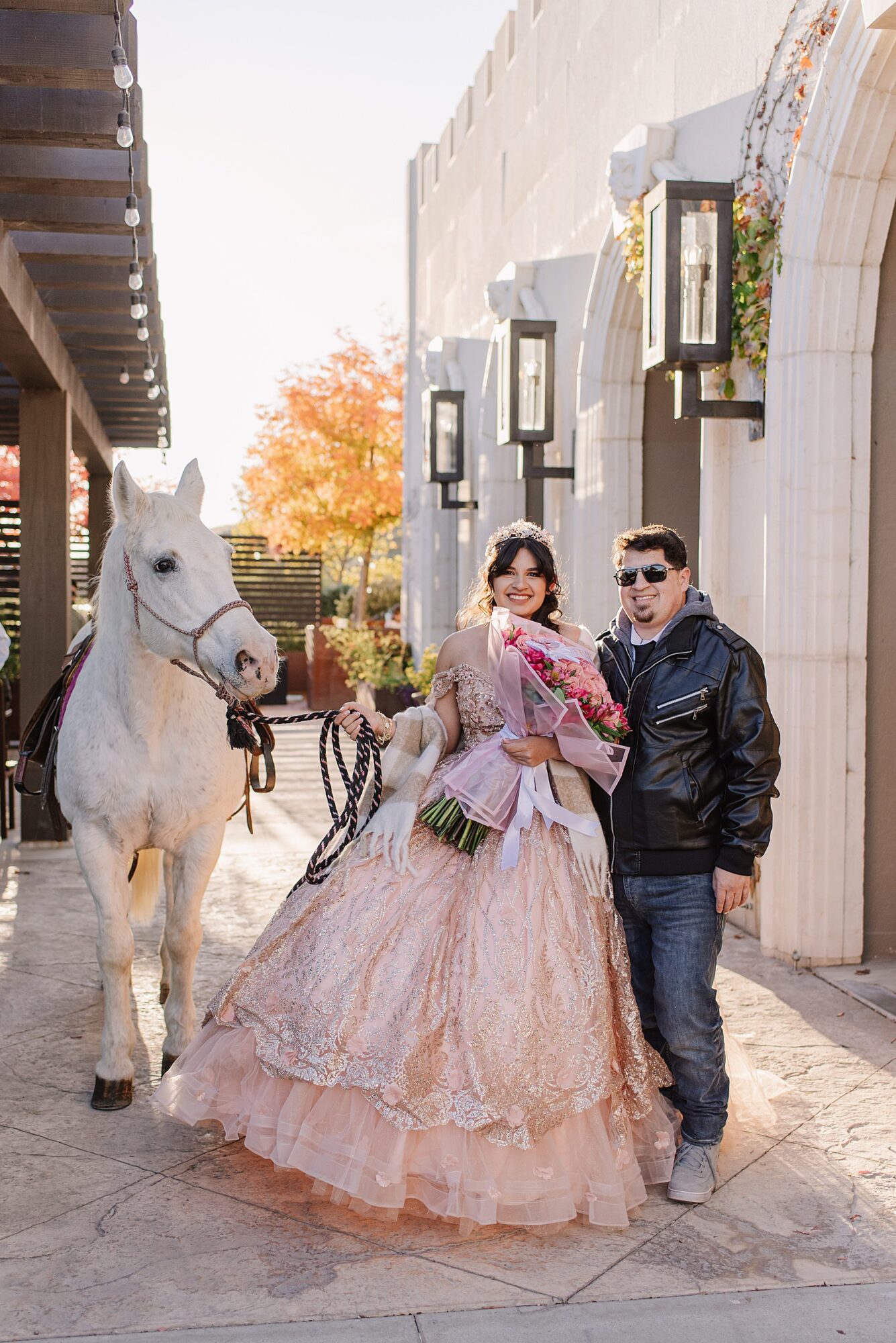 Mary Luz arrives at her Tooth + Nail Winery Quinceañera with a majestic white horse, showcasing a unique and unforgettable entrance to her celebration