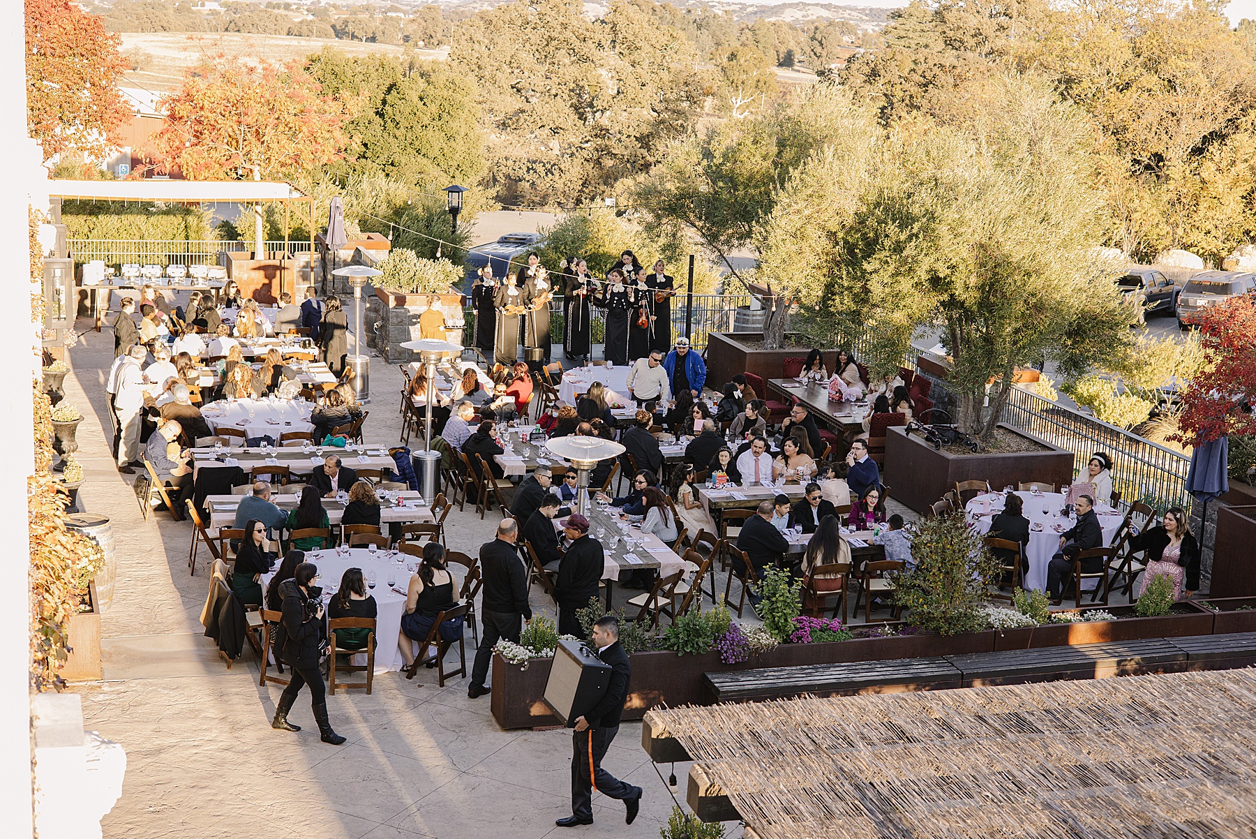 Guests enjoy an elegant outdoor dining experience at Tooth + Nail Winery during Mary Luz's unforgettable Quinceañera celebration.