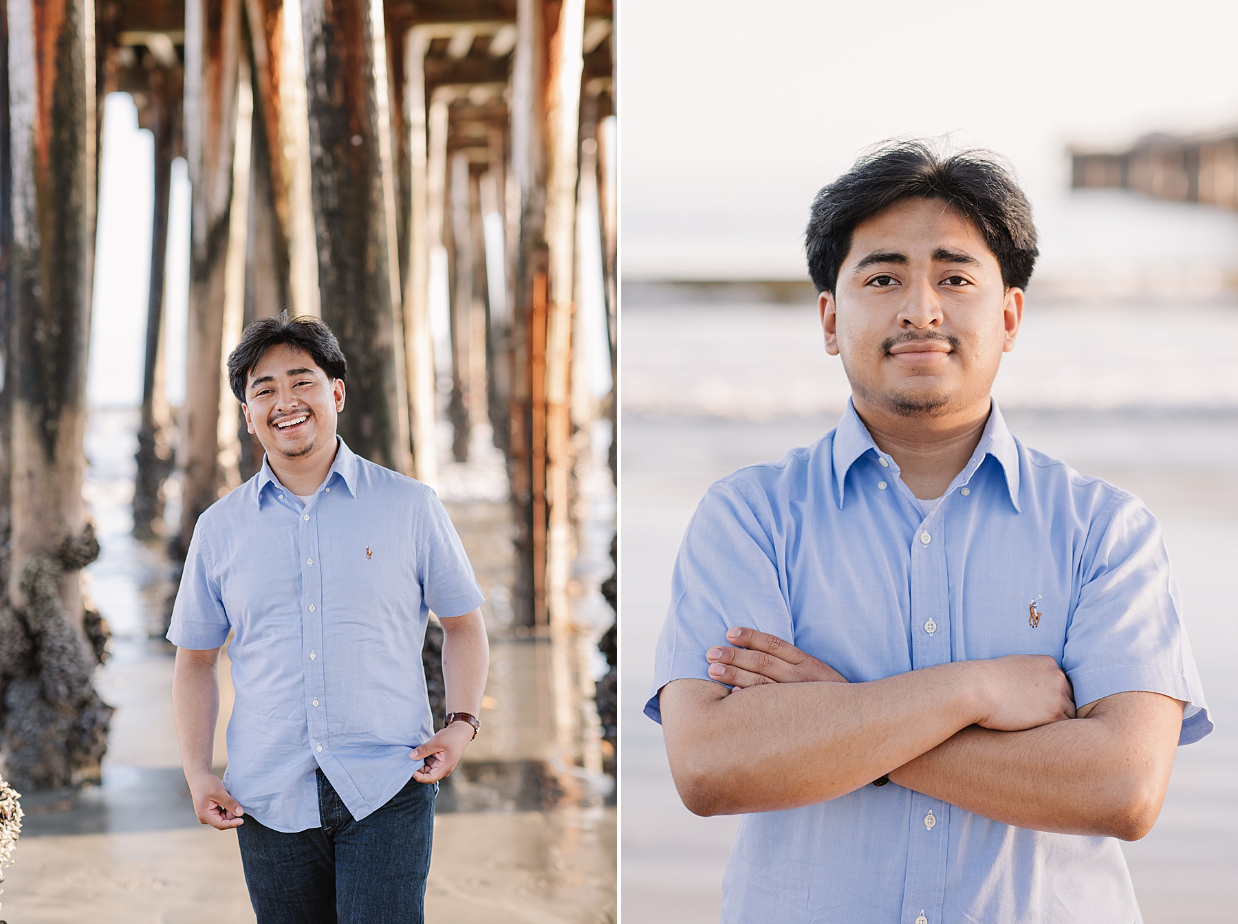 Senior boy smiling under a wooden pier along the beach at a popular california spot wearing a light blue button-up shirt.