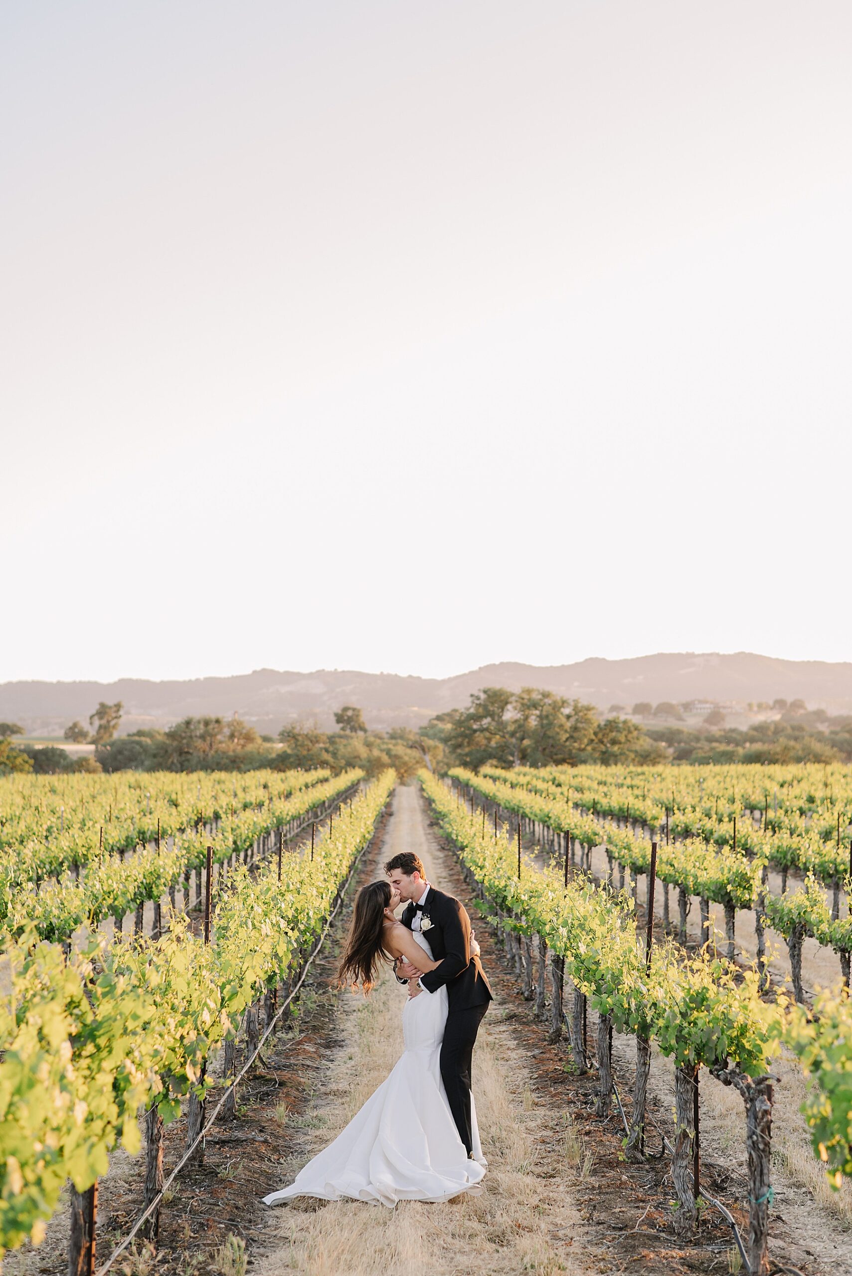 Discover Mira Vista Estate, a Tuscan-inspired wedding venue in Paso Robles offering stunning vineyard views, luxurious accommodations, and unforgettable photo backdrops.