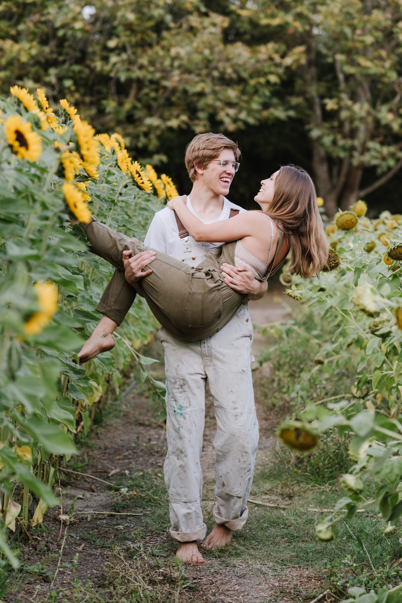Man carrying girl in his arms at engagement session